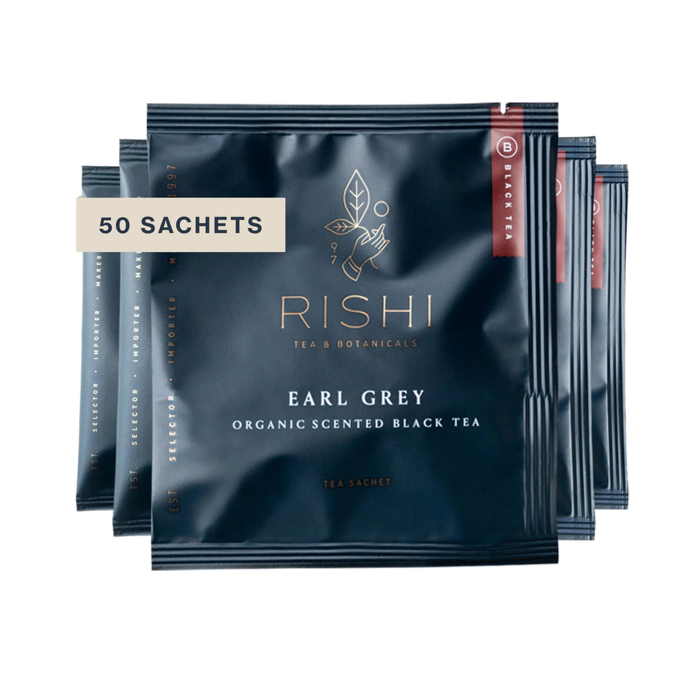 Rishi Tea Earl Grey tea bag in cup with bergamot aroma, ideal morning pick-me-up.