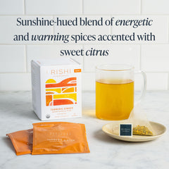 Rishi Tea Turmeric Ginger sachet pack on display emphasizes organic, ethical sourcing.