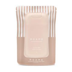 Roame Cloud 999 sanitizer spray bottle in hand for quick hygiene on the go.