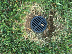 Rocky Mountain Goods UV-resistant black plastic grate protects outdoor drains from sun.