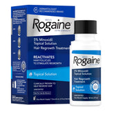 Rogaine men's extra-strength minoxidil bottle ready for daily use to support regrowth.