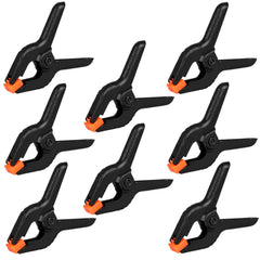 Romeda 12-pack plastic spring clamps for secure backdrop setups.