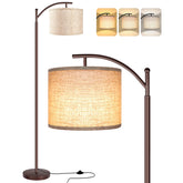 ROTTOGOON floor lamp with beige shade angled for focused reading and ambient living room lighting.