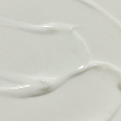 RŌZ Milk Hair Serum label closeup highlighting vegan formula.