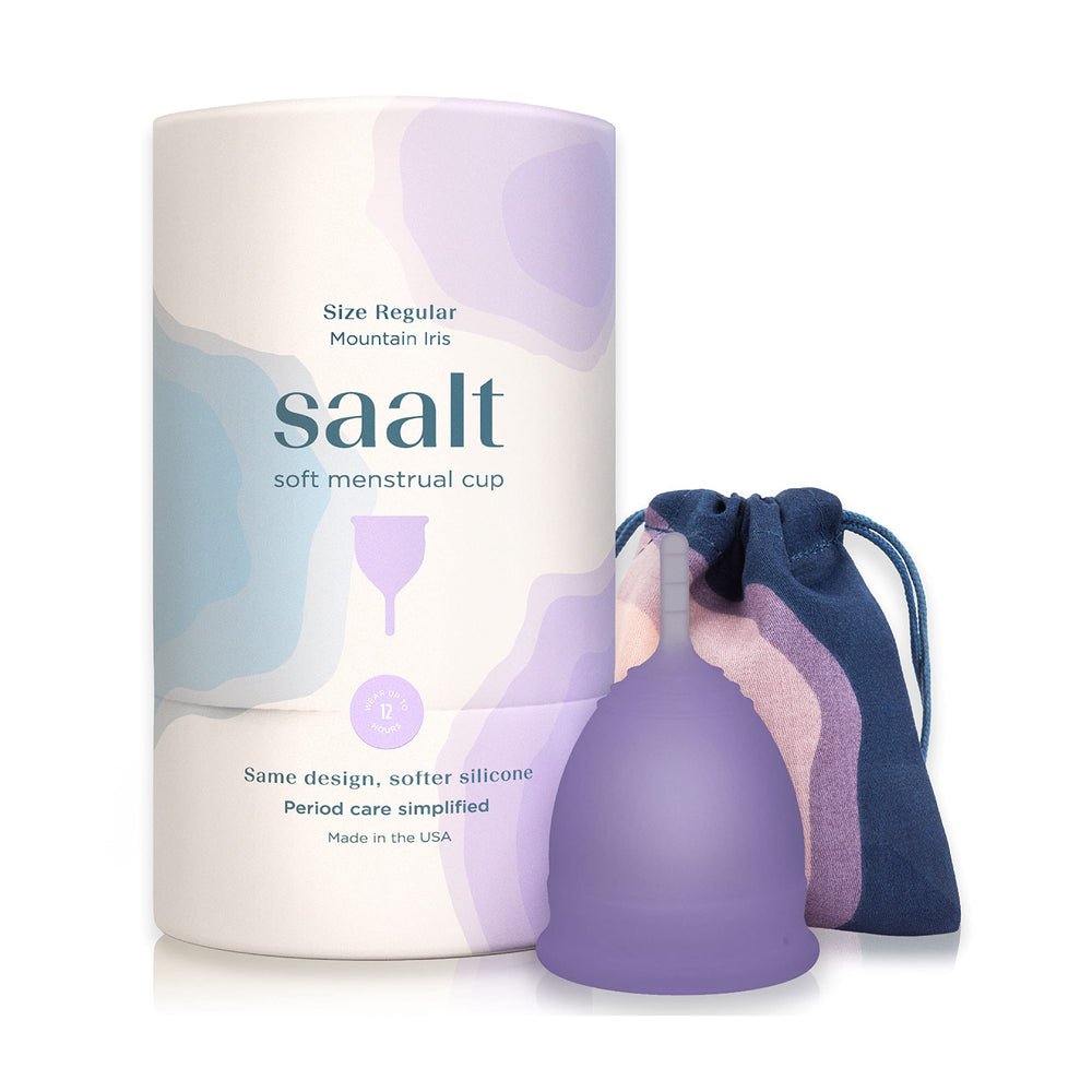 Saalt Soft menstrual cup Mountain Iris held in hand for flexible, leak-free comfort.