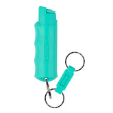 SABRE pepper spray with quick-release keychain for fast access during emergencies.