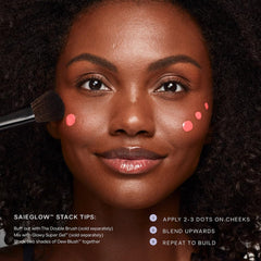 Saie Dew Liquid Blush Trio application on cheeks demonstrates blendable texture.