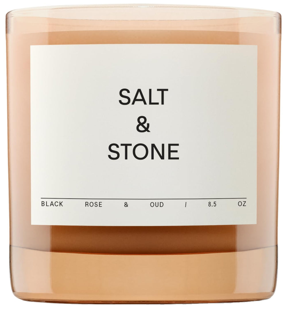 Salt & Stone Black Rose & Oud candle jar enhancing home fragrance and decor.