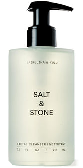 Salt & Stone facial cleanser bottle pouring for a refreshing cleanse.