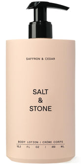 Salt & Stone bottle with saffron-cedar scent for daily hydration.