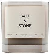 Salt & Stone Santal Vetiver candle in a jar creates a warm ambiance.