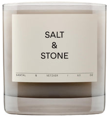 Salt & Stone Santal Vetiver candle in a jar creates a warm ambiance.