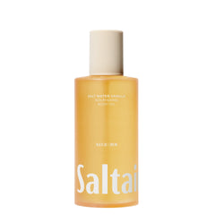 Saltair applying oil to damp skin after shower for quick absorption.