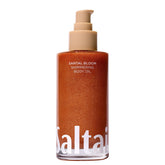 Saltair Shimmering Body Oil bottle with Santal Bloom for radiant, lightweight moisture boost.
