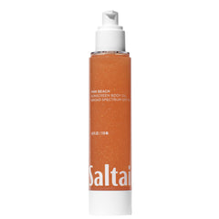 Saltair SPF Body Oil pink beach bottle shows sun protection and lightweight moisture.