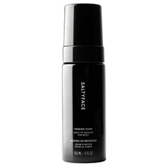SALTYFACE tanning foam bottle front; vegan self-tanner for an even, natural-looking glow.