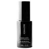 SALTYFACE tanning water on face, neck, and chest for a natural glow.