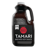San-J gluten-free tamari bottle pour enhances savory umami in stir-fries.