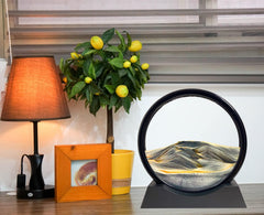 SANDCLE liquid motion sand art on a display stand for desk use.