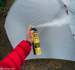 Sawyer Permethrin being applied with bottle held at distance