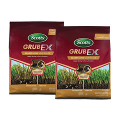 Scotts GrubEx1 bag beside a spreader ready for spring application to prevent grub damage.