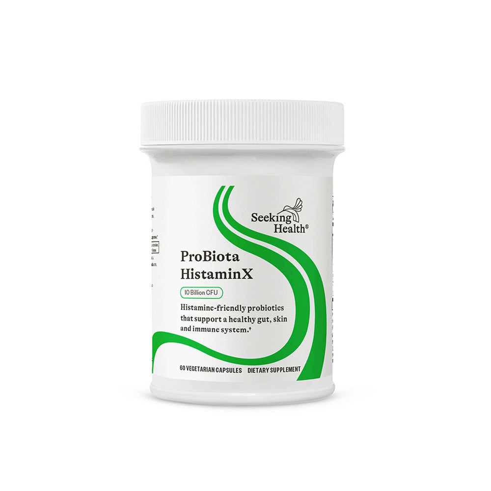Seeking Health ProBiota HistaminX bottle on counter suggesting daily gut support.