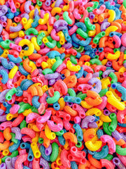 Sensory-N-Stuff Rainbow Pasta in sensory-bin setup invites imaginative play