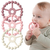 Seposeve ring teether with five textures on both sides to soothe gums.