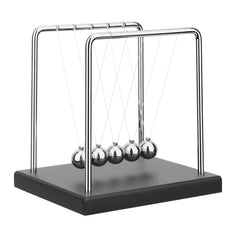 SEVNPRIME 5-bead Newton's cradle on a black base demonstrates momentum transfer on a desk.
