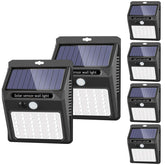 SEZAC Solar Lights Outdoor 6-pack illuminating garden paths safely