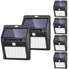 SEZAC Solar Lights Outdoor 6-pack illuminating garden paths safely