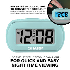 Sharp digital alarm clock compact size suits desk or nightstand portability