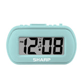 Sharp digital alarm clock with tactile case promotes easy grip at bedside