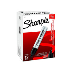Sharpie Pro marker in hand prepared for labeling boxes with bold black ink.