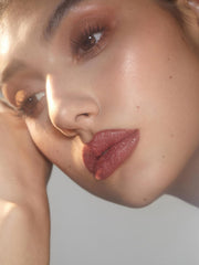 SHEGLAM Lip Dazzler glitter particles add eye-catching lip sparkle.