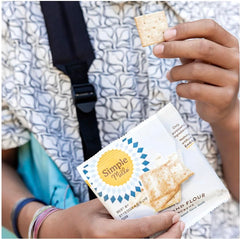 Simple Mills gluten-free crackers on a cheese board offering gluten-free crunch