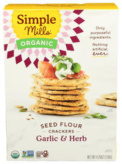 Simple Mills Garlic and Herb Organic Seed Crackers in a box, pantry-friendly gluten-free snack.