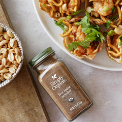 Simply Organic Five Spice Powder in pan with vegetables for stir-fry.