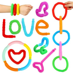 Kids connecting and twisting Siwarm pop tubes for imaginative shapes