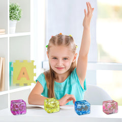 Siwarm stress cube 4-pack being squeezed, showing tactile relief during work