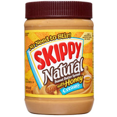 SKIPPY Natural Creamy Peanut Butter with Honey jar pour showing smooth texture for easy spreading