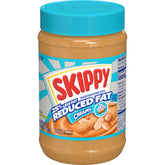 SKIPPY reduced fat creamy peanut butter spread jar with smooth texture for quick snacks.