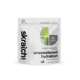 Skratch Labs Unsweetened Hydration powder dissolves in lemon-lime water for balanced electrolytes during workouts.