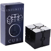Small Fish Infinity Cube opened in hand showing eight tactile blocks for smooth fidgeting.