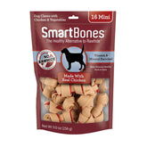 SmartBones Mini Bones with real chicken inside wrap, a tasty, digestible chew for dogs.