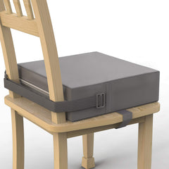 SMZCTYI toddler booster seat on grey dining chair provides stable mealtime seating