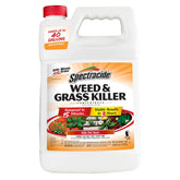 Spectracide Weed & Grass Killer bottle ready for spot treatment on a patio