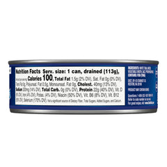 StarKist albacore tuna in water, opened can over a salad for quick lunch.