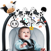 Stuffed Spiral Cow car-seat toy with high-contrast visuals supports visual tracking.