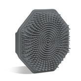 Sud Scrub Charcoal Face Scrubber front view with ergonomic grip for easy cleansing.